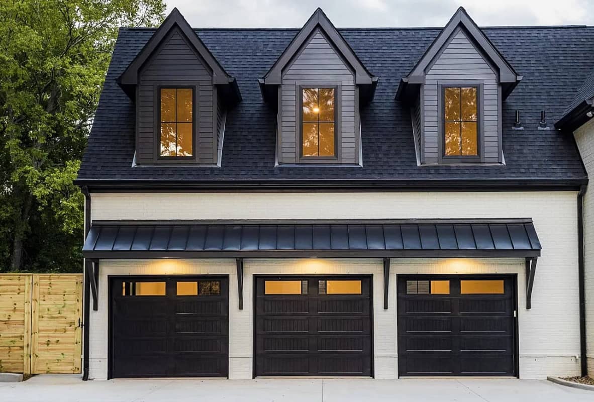 Stamped carriage house garage doors in black