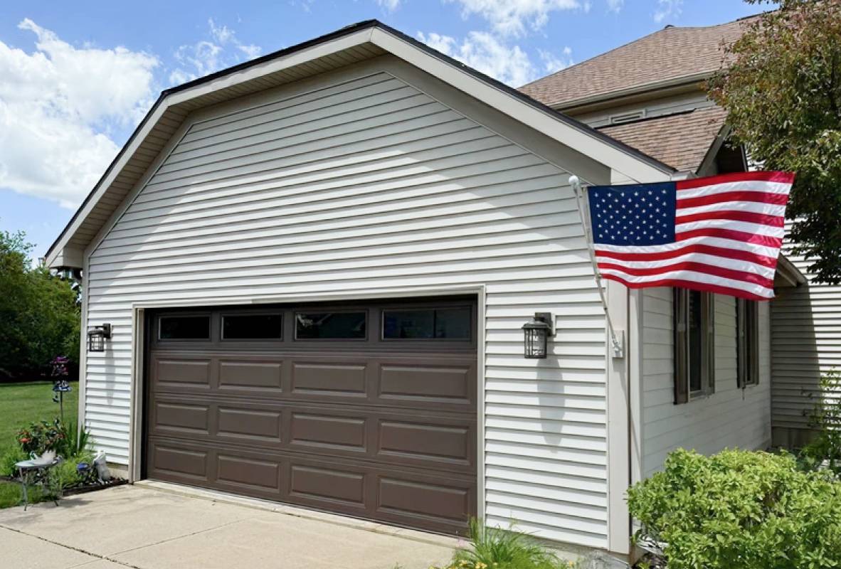 Raised panel garage door in brown