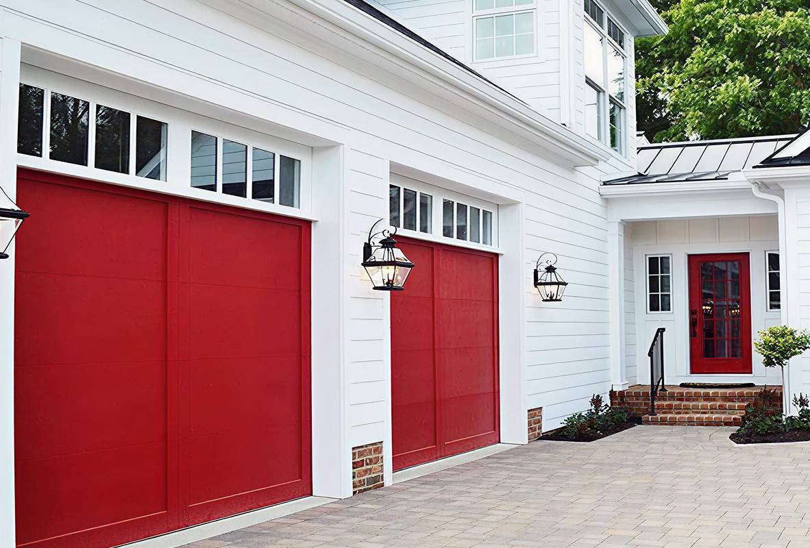White house with two red garage doors