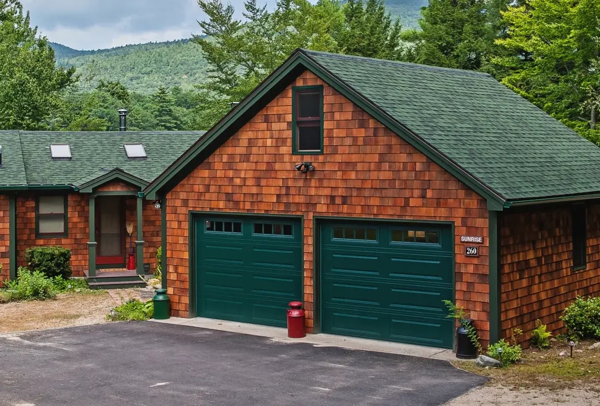 Lakeside out with two green garage doors