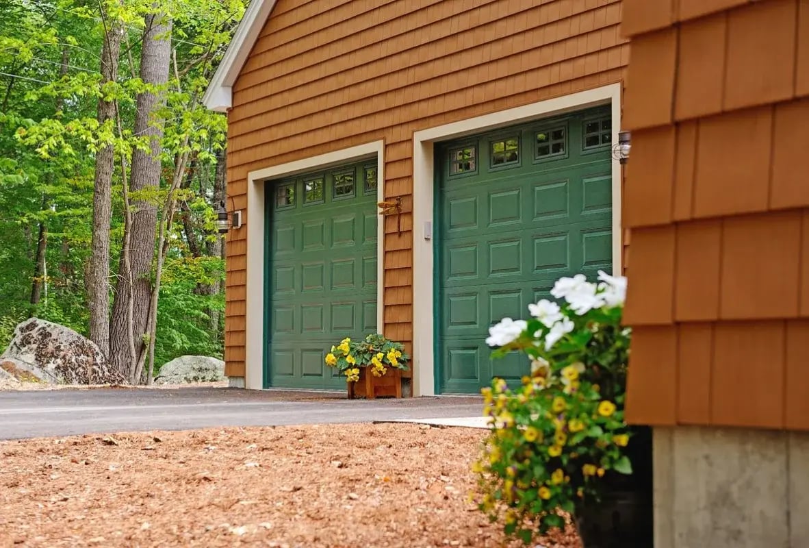Raised panel garage doors in green