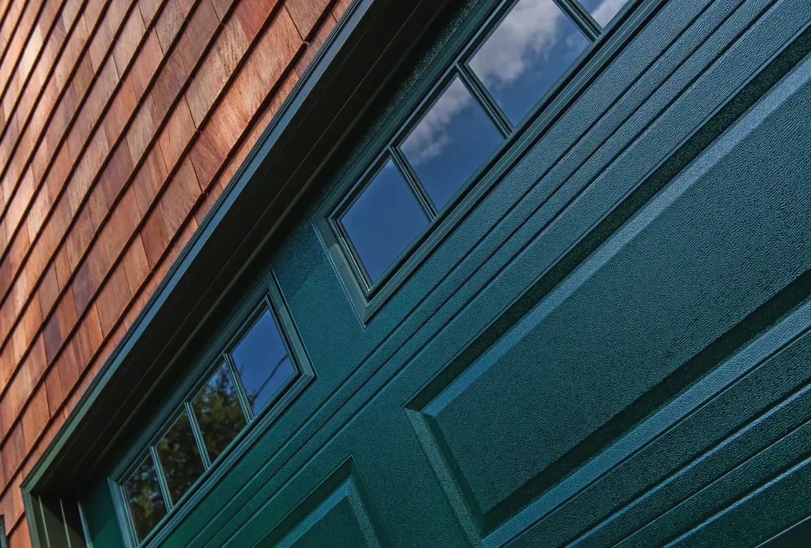 close up of raised panel garage door in evergreen