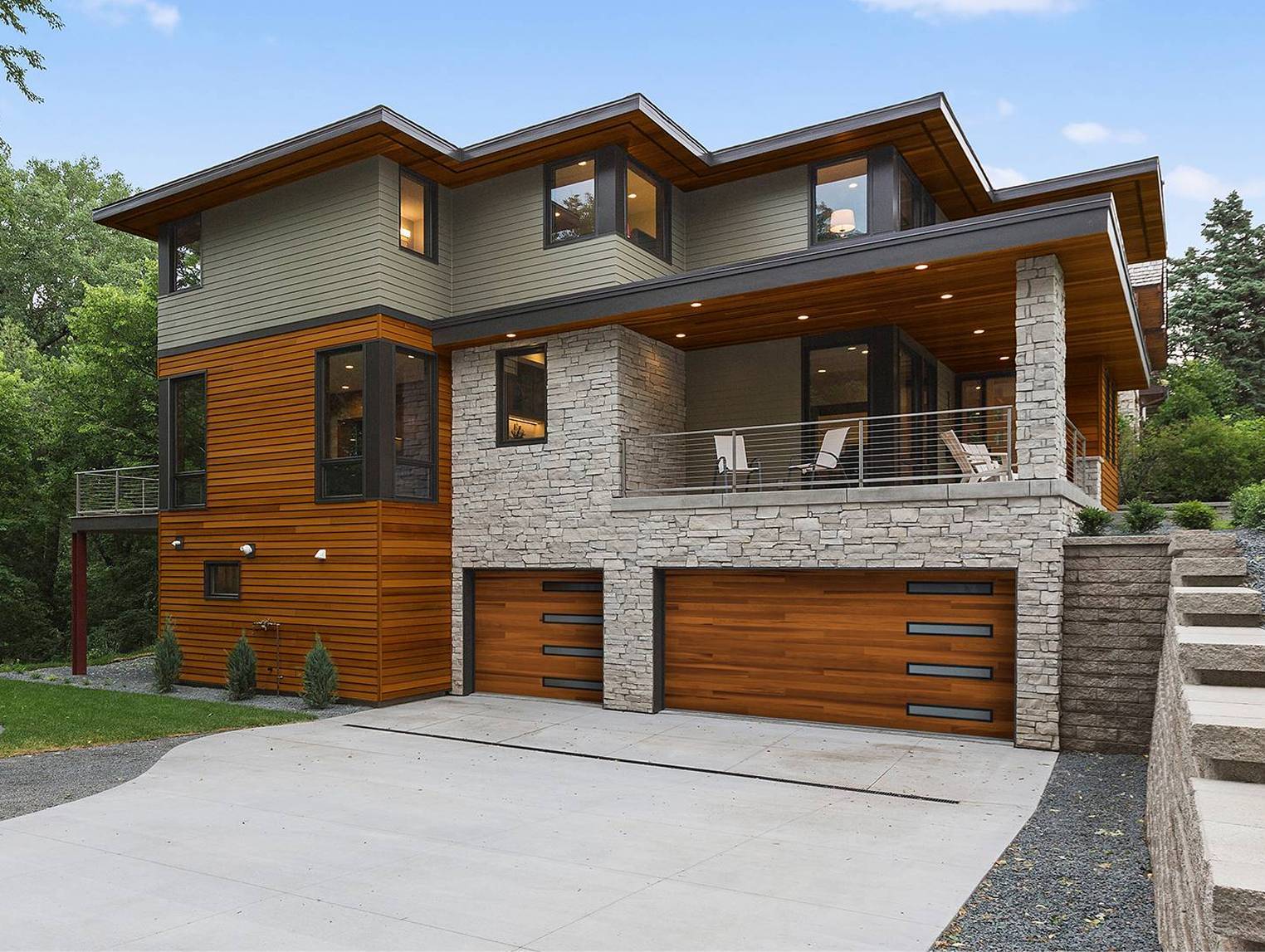 Modern gray stone house with wood panelling