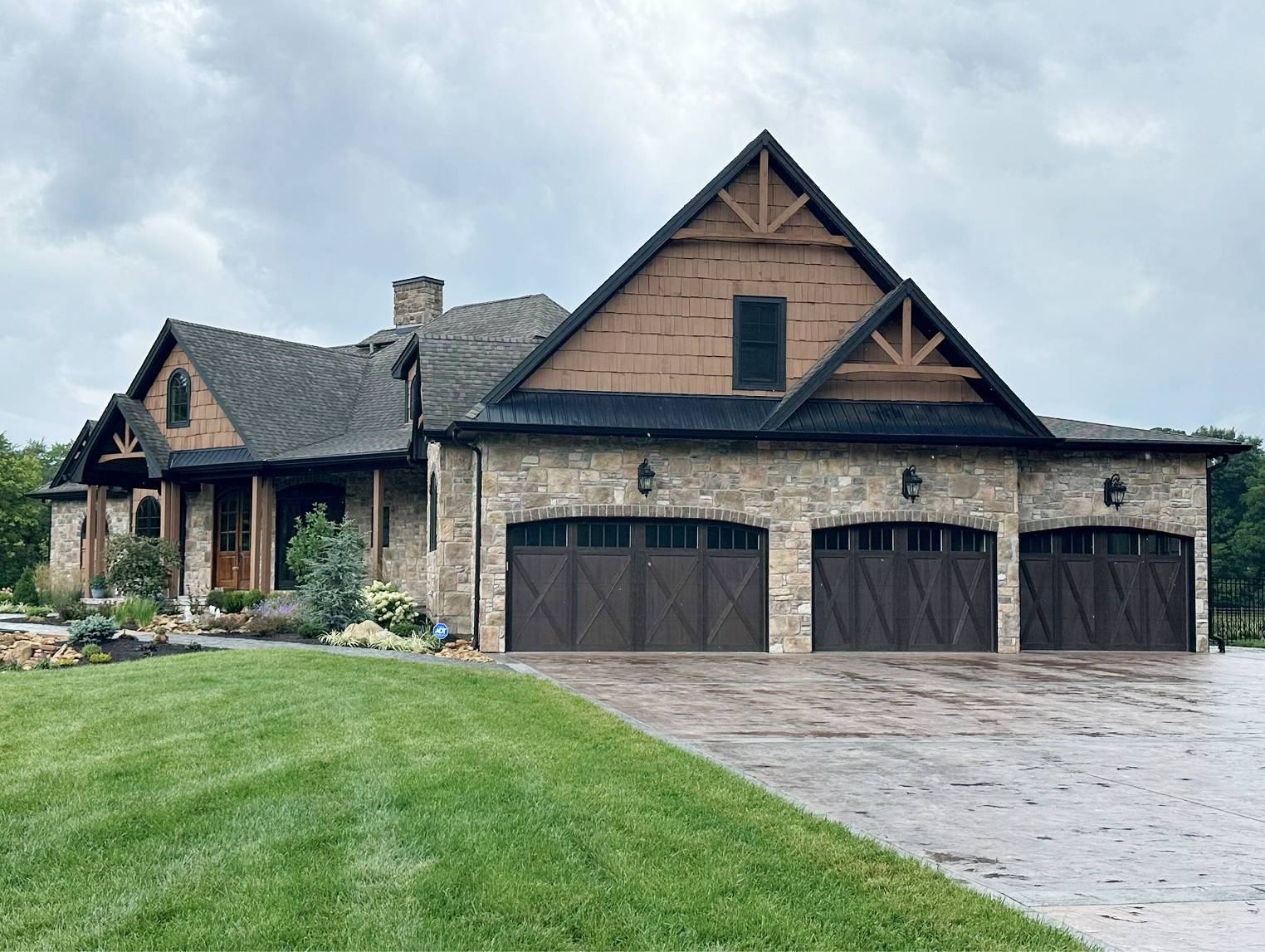 Stone house with brown and black accents